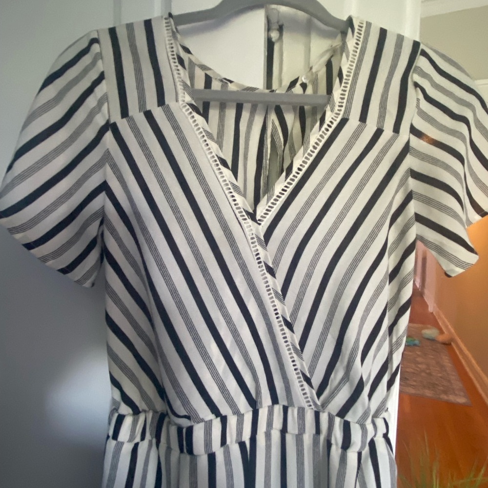 Never worn full jumpsuit size XS. Super cute, flowy material